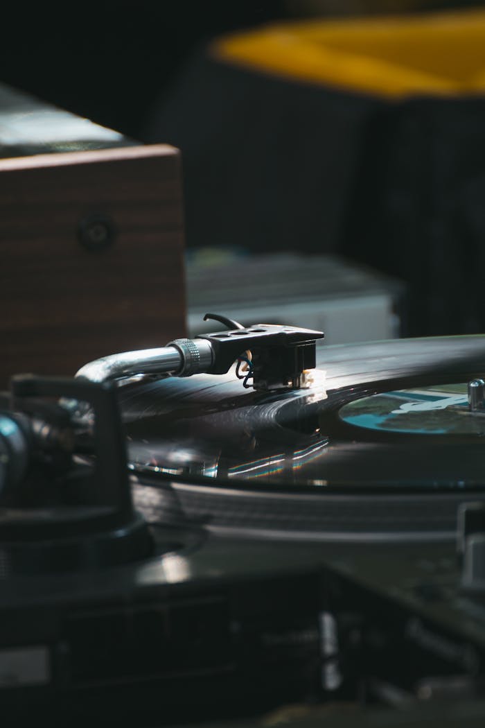 A detailed shot of a vinyl record spinning on a turntable, capturing the essence of analog music.